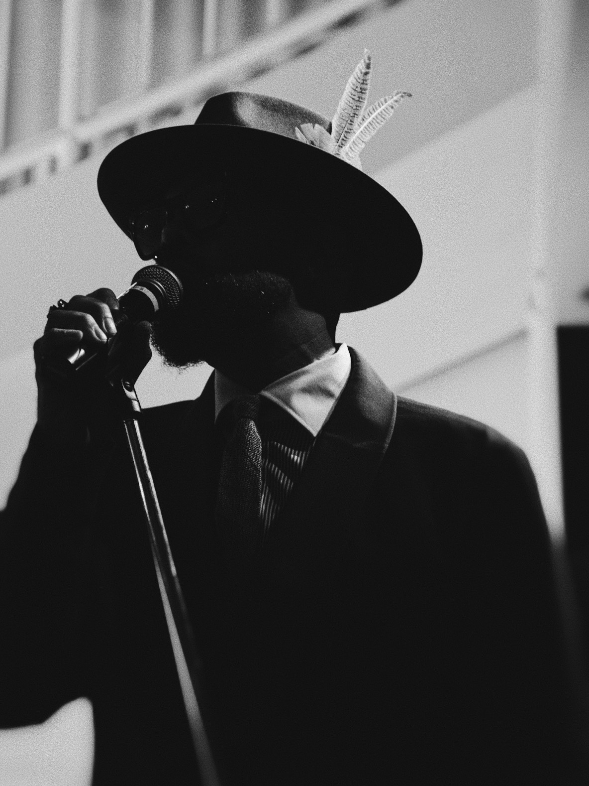 Performer silhouetted at microphone